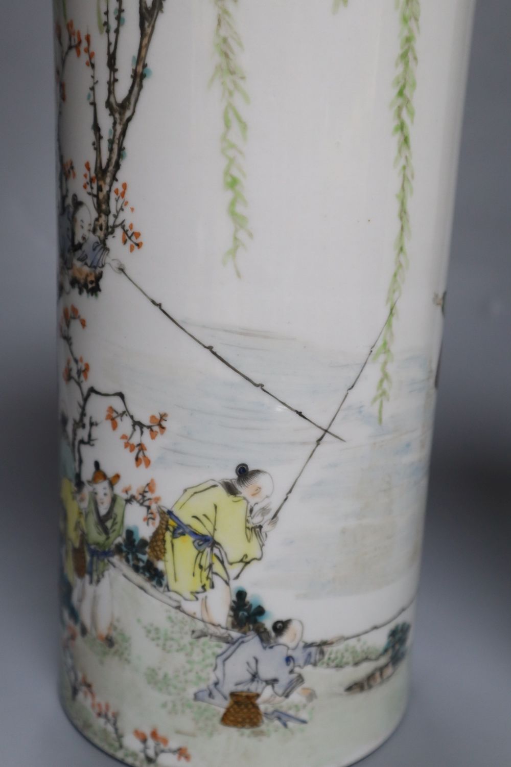 A pair of Chinese cylindrical porcelain vases, enamelled with fisherfolk, 29cm